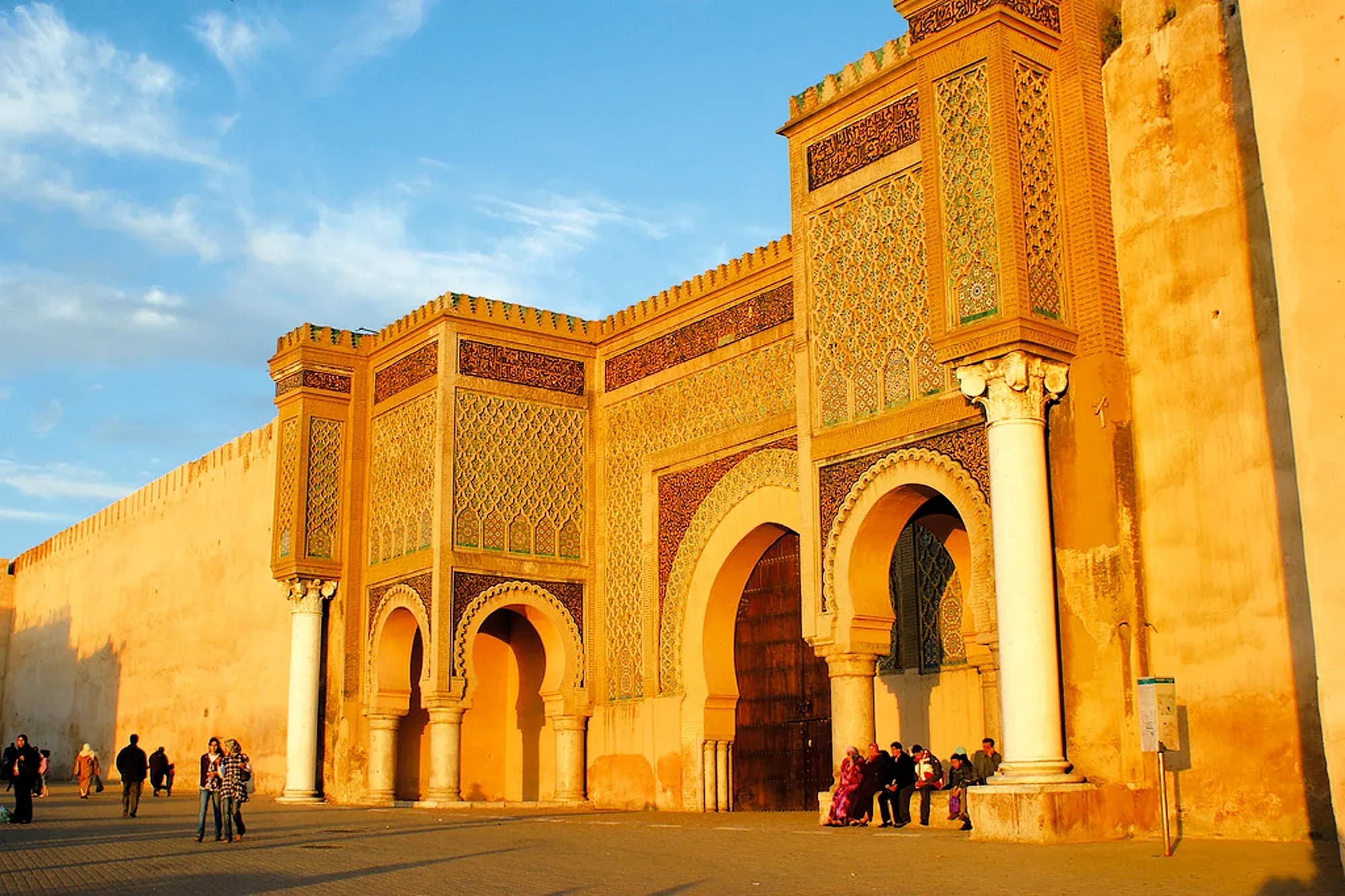 Bab Mansour gate in Meknes lit by golden sunset light
