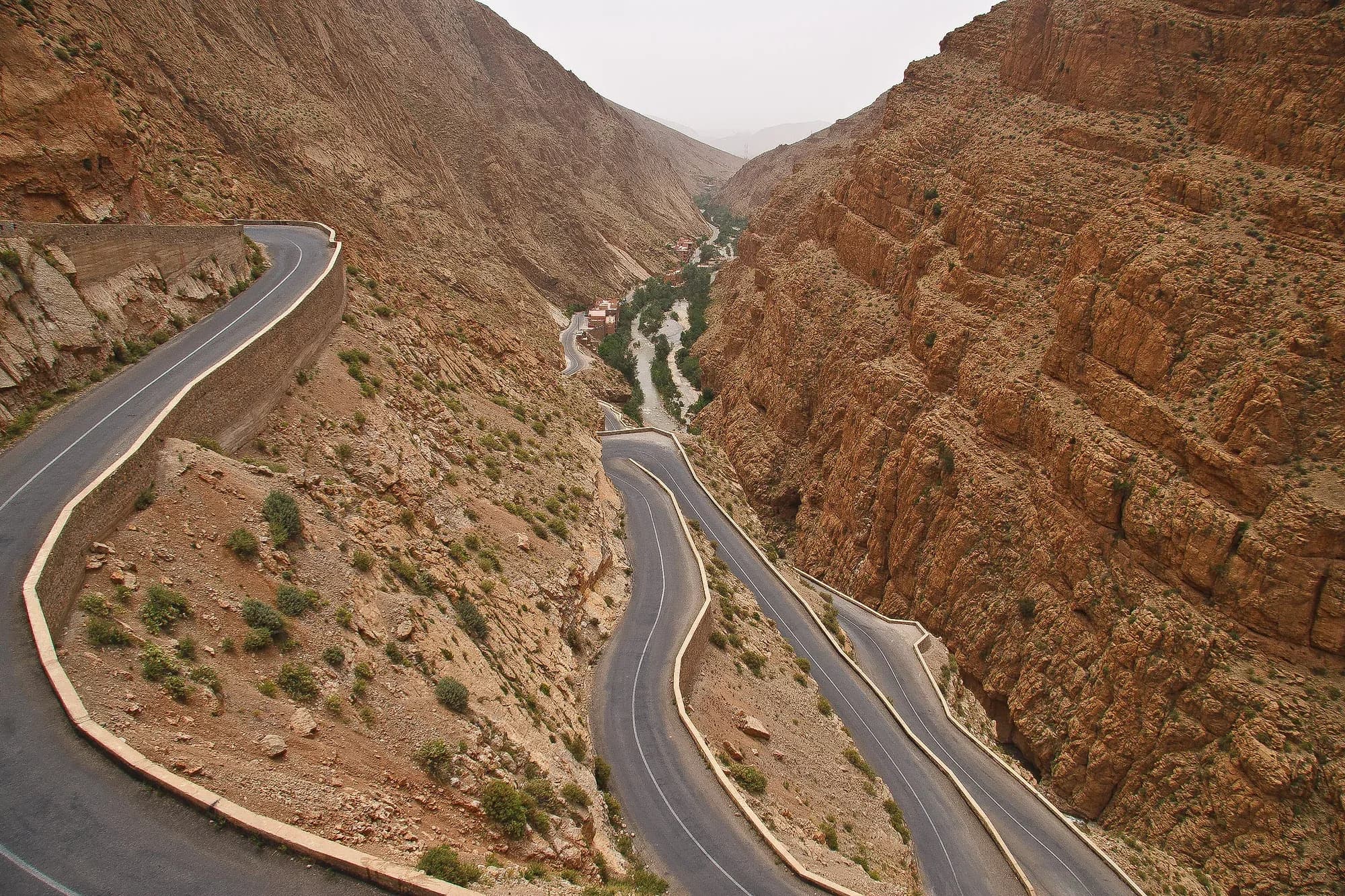 Bends of the Tisdrine road descending through the Dades Gorge between rock walls