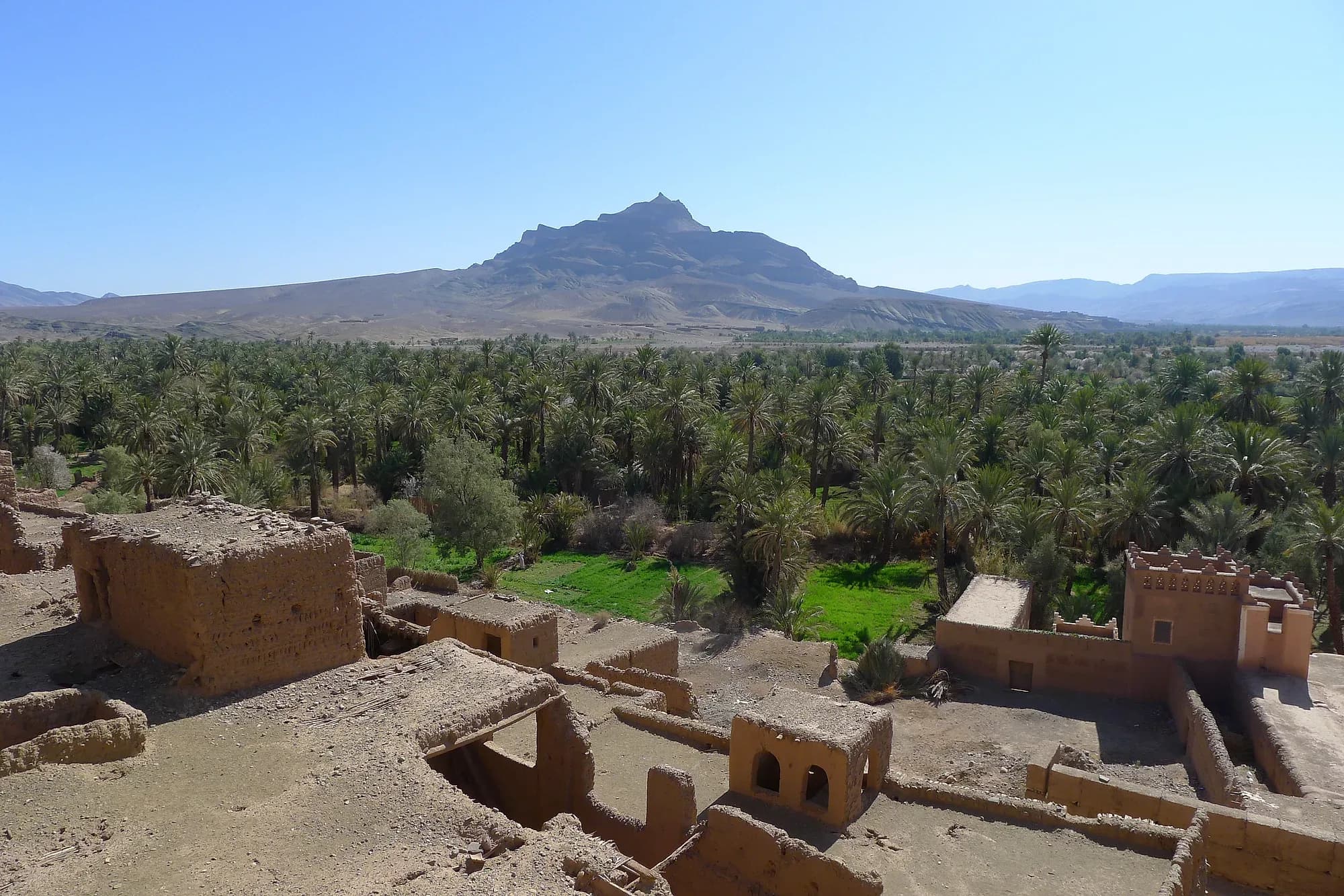 Mud-brick kasbahs and palm grove of Agdz below Jbel Kissane, Draa Valley