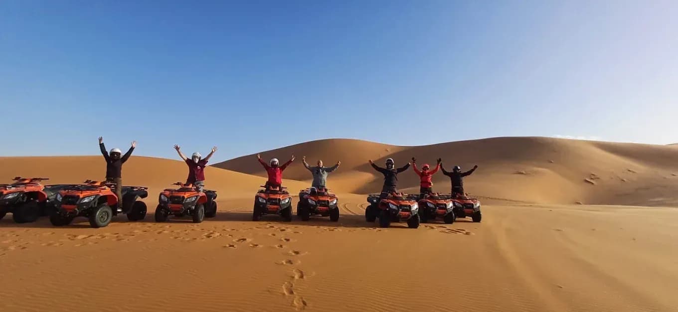 Group on quad bikes on the dunes