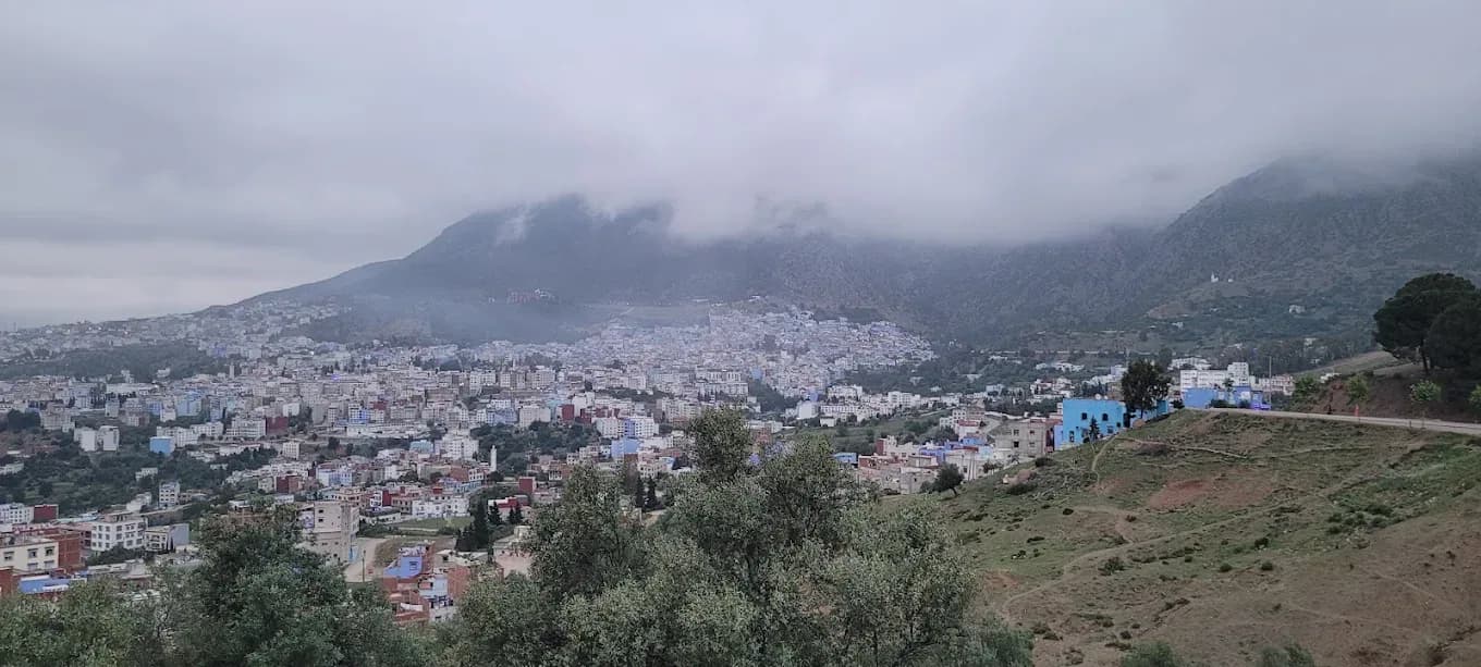 View of Chefchaouen with the Rif Mountains in the clouds