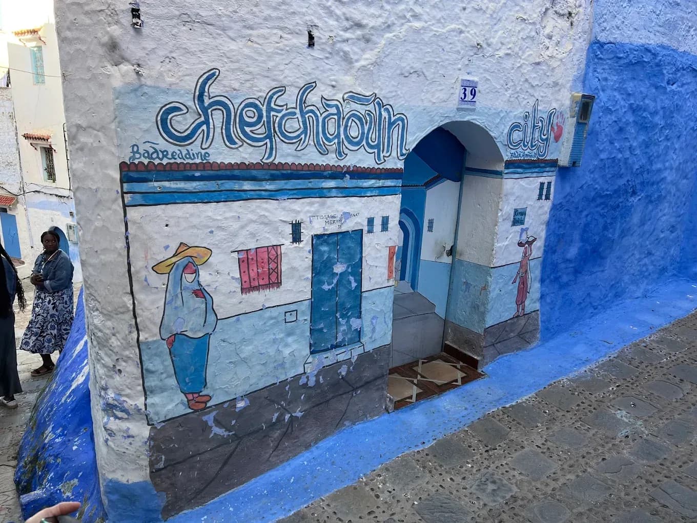 Blue-painted wall with the name Chefchaouen