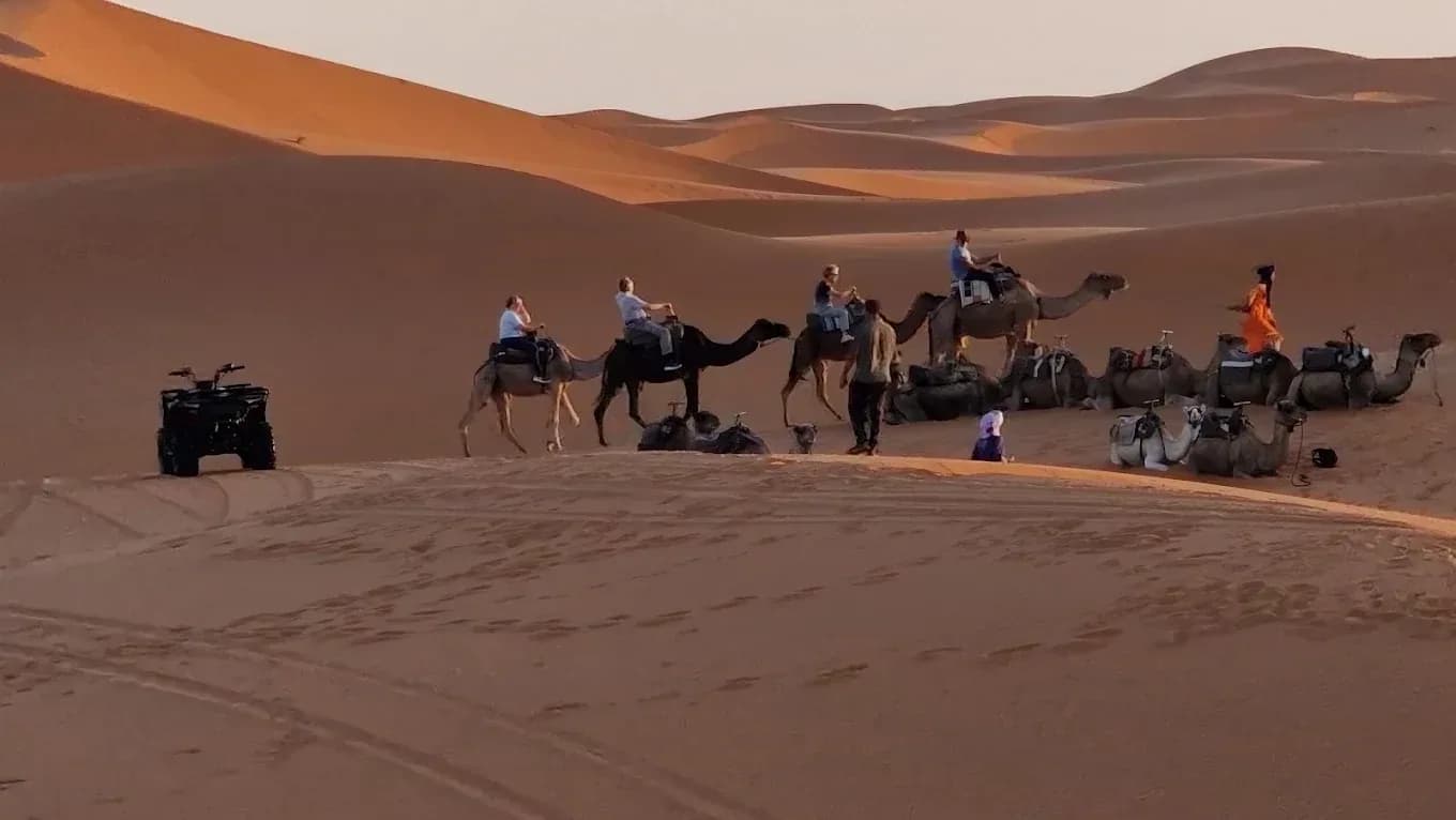Caravan and quad bike on the dunes