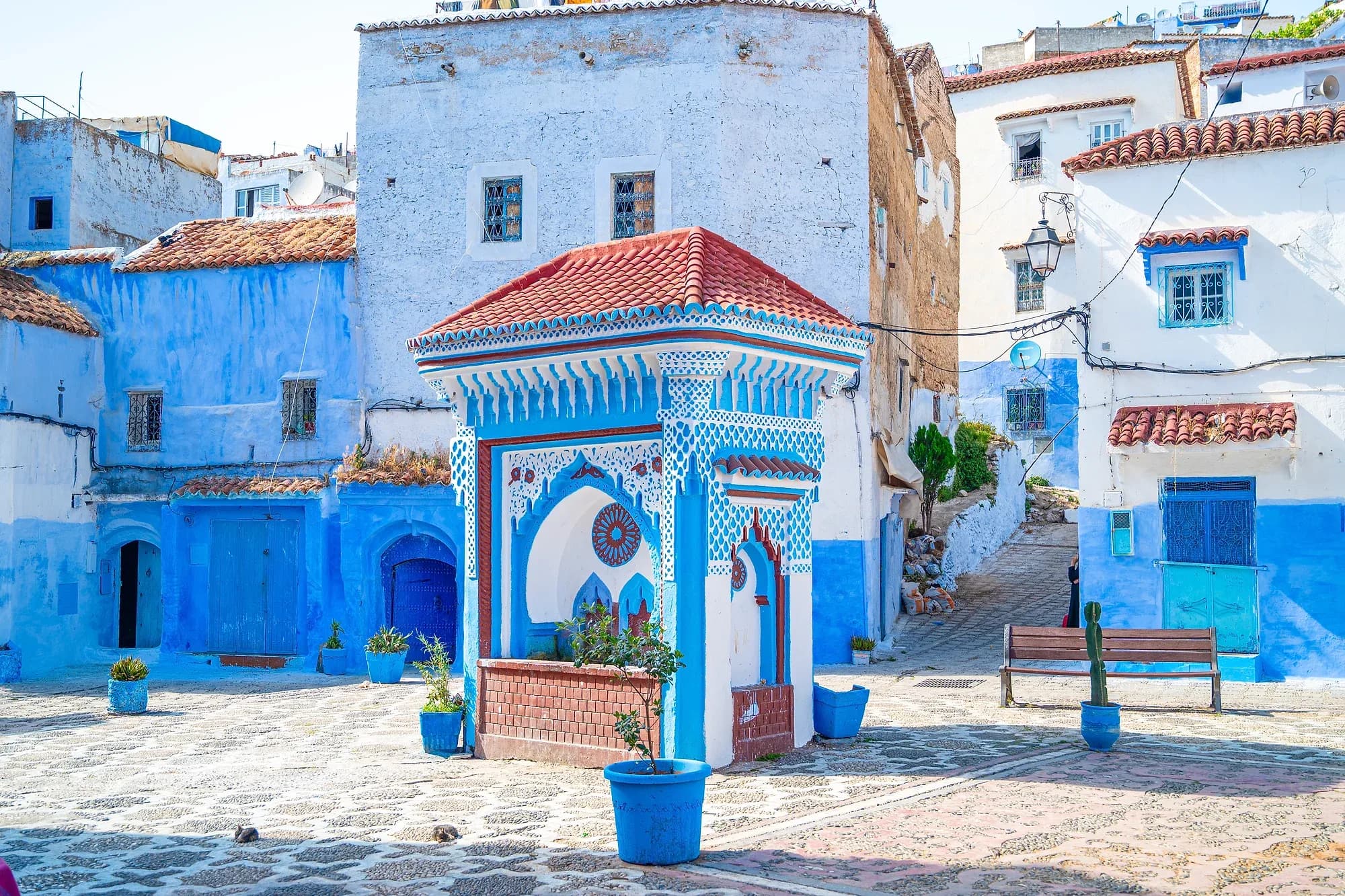 El Haouta square fountain among blue and white houses in the Chefchaouen medina