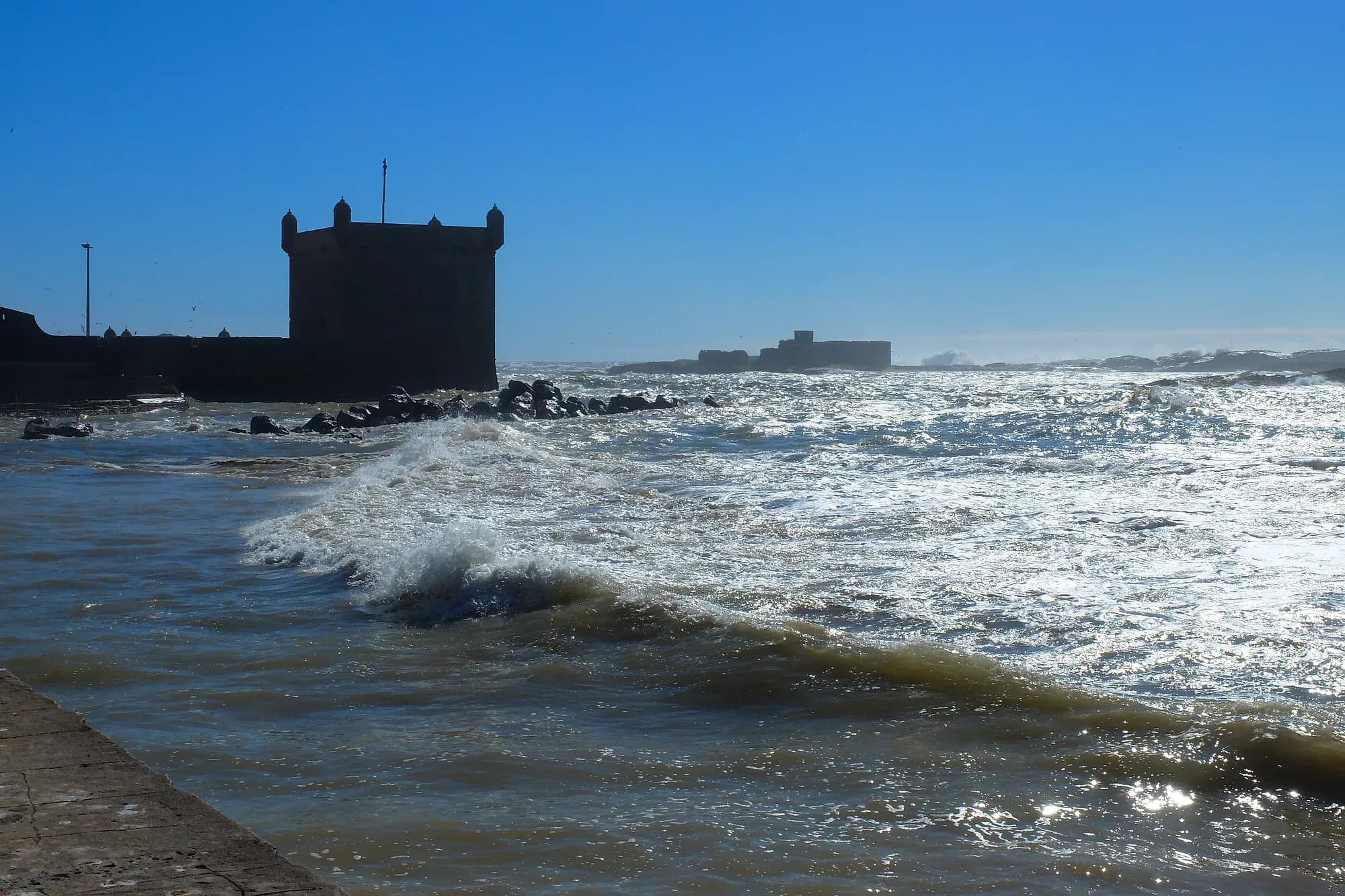 Atlantic waves breaking beside a bastion of the Essaouira ramparts