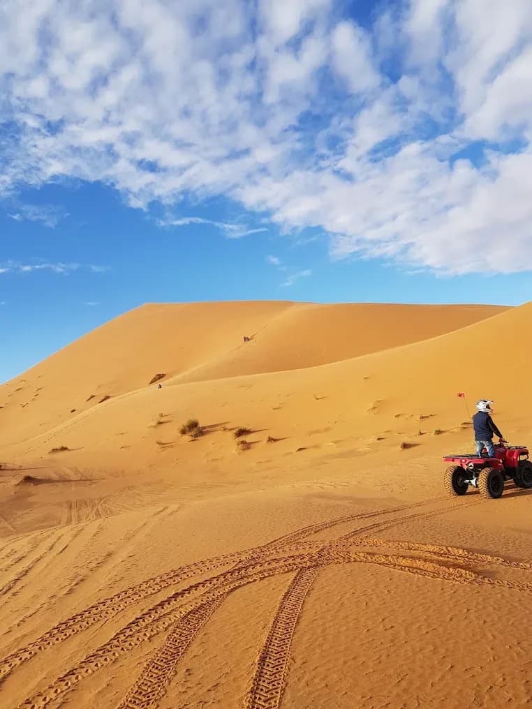 Quad bike on top of a dune