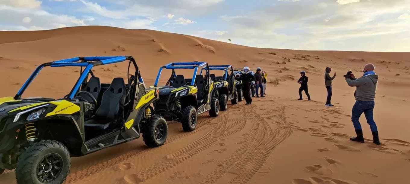 Group with buggies on the dunes