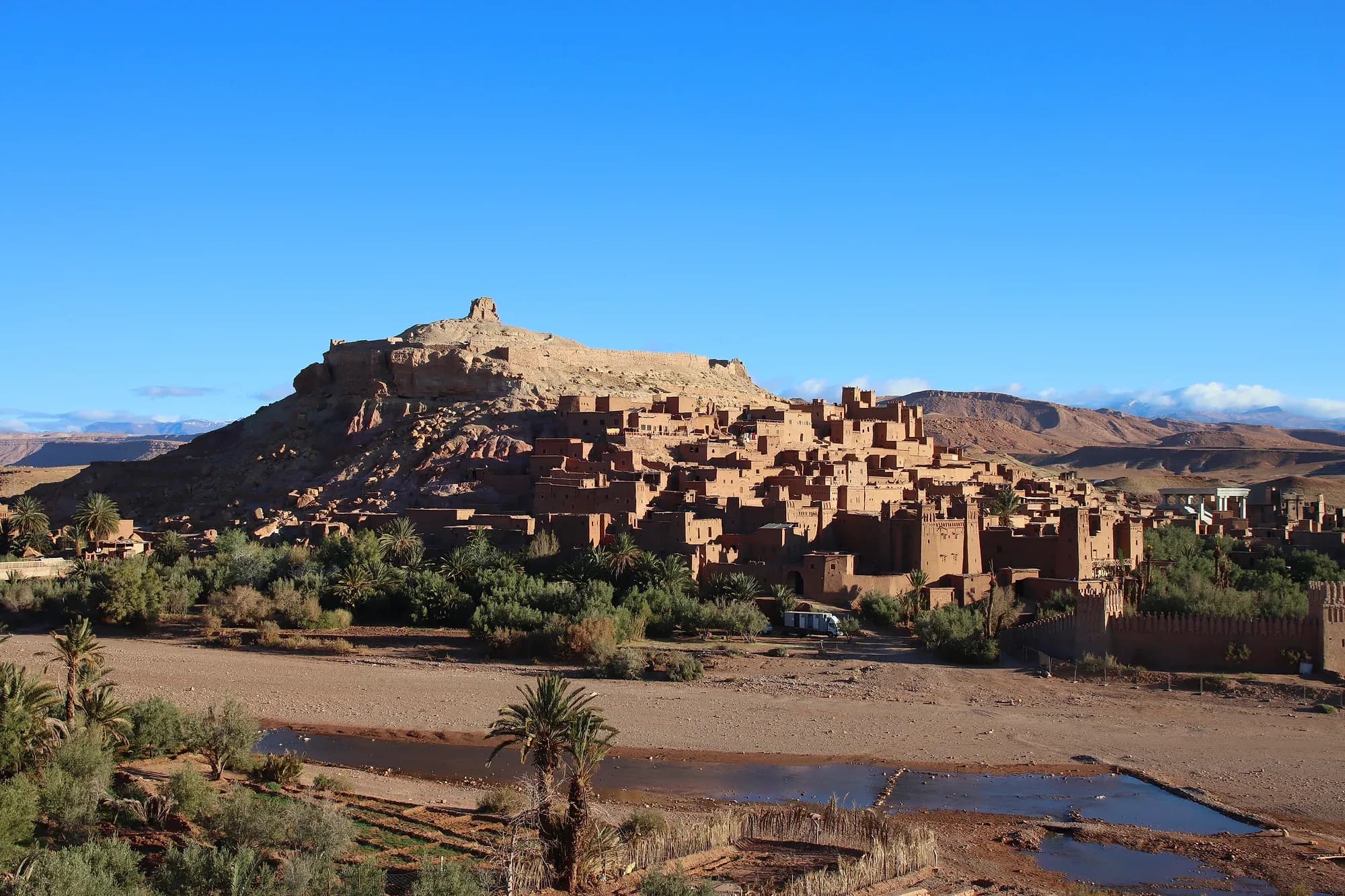The ksar of Aït Ben Haddou on its hill, with the Ounila River and palm grove in the foreground